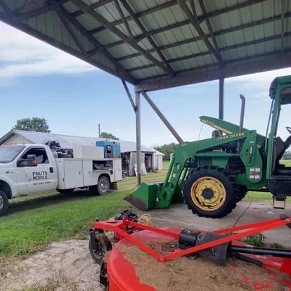 Tractors, tools and a service truck — PNUTS Mobile